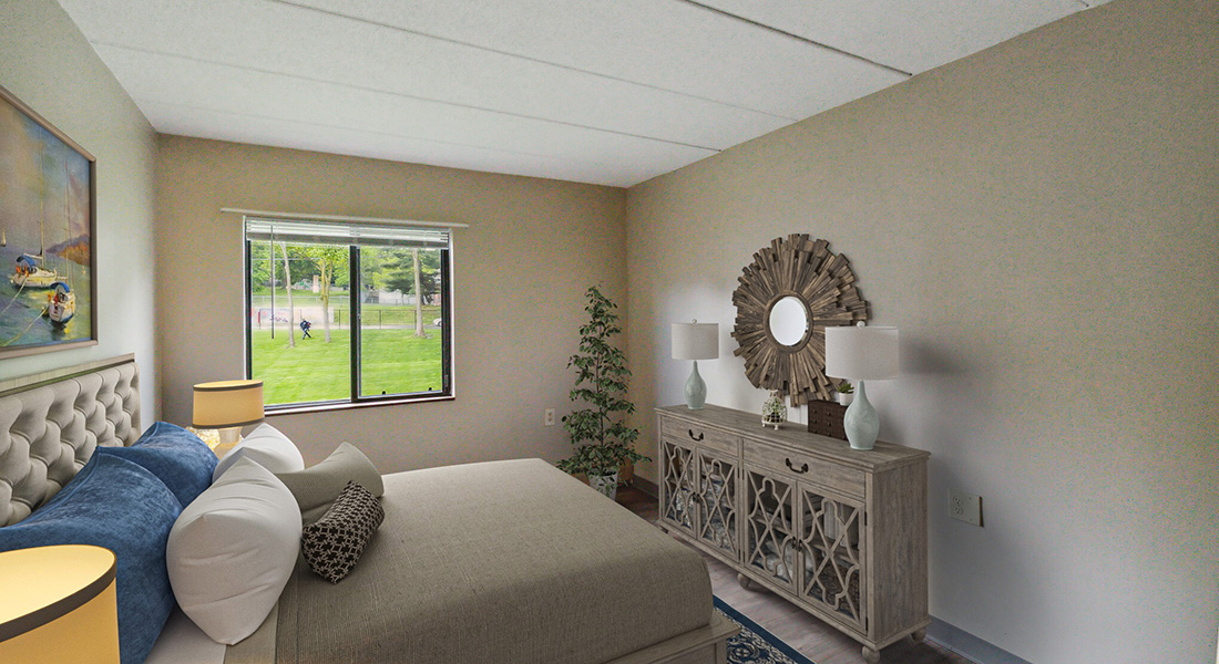 Bedroom inside a unit at East Side Apartments